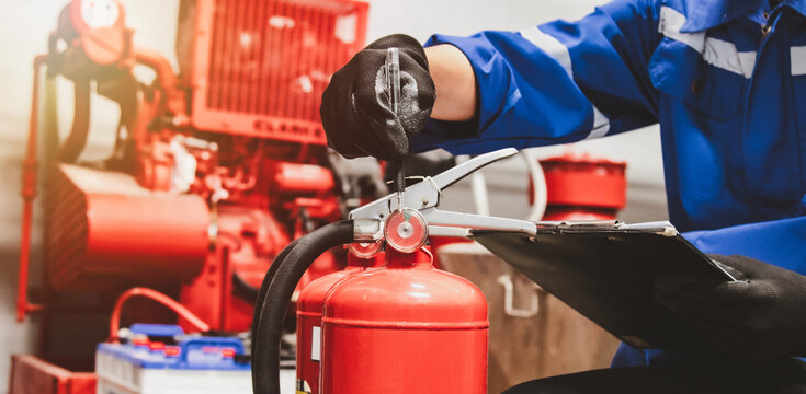 Engineer check fire suppression system,check fire extinguisher tank in the fire control room for safety