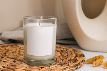 Aromatic candle with empty label close-up