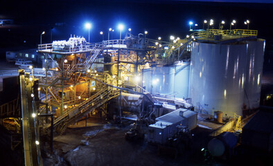 Elevated view of Gold Mine processing at night - obrazy, fototapety, plakaty