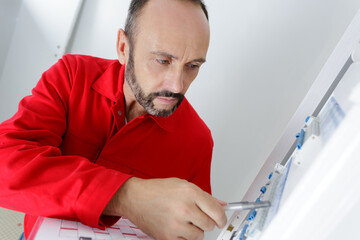 an electrician and voltage switchboard