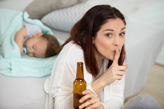 mother drinking beer asking for silence