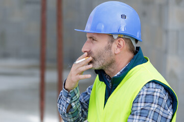 male worker smoking a cigarette