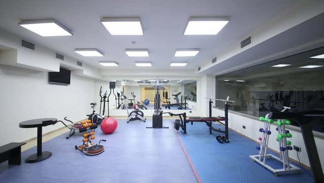 Lights turn off and turn on in the gym in Hotel National