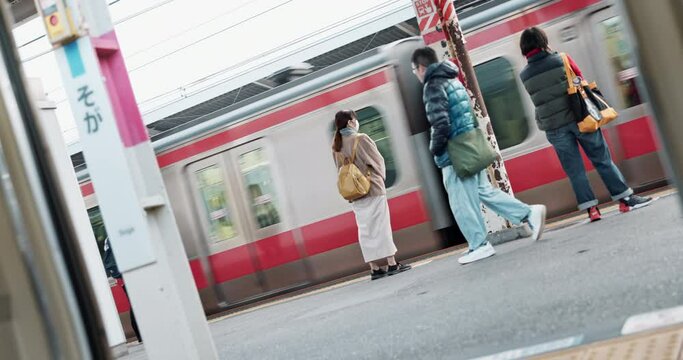 People, Japanese train station and waiting for transport, journey or metro railway for tourism. Commute, travel and infrastructure with men, women or walking on urban platform for locomotive in Tokyo