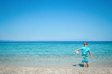 Obraz premium A happy child by the sea in nature weekend travel
