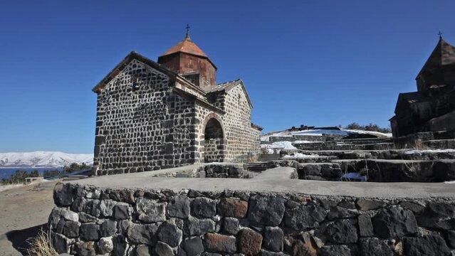 Building of monastery Sevanavank on Sevan lake in winter sunny day
