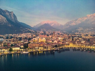 Drone shot of the city of Lecco and Lake Como, Italy. Mount Resegone in the background