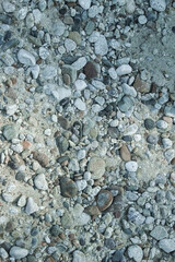 A pebbles on the shore of the sea travel background