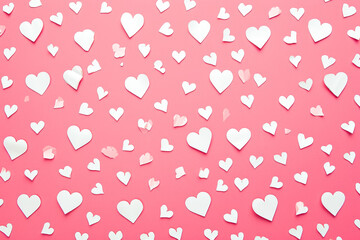 pattern of white hearts on a pink background with a border of small hearts
