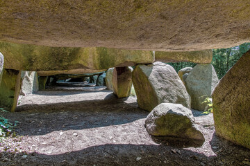 Low angle view underneath Dolmen (hunebed) D27 close to Borger in the Netherlands which is a megalithic tomb or burial mound with large stones dating back to Neolithic period, about 5.000 years ago