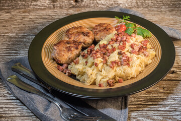 Minced meat cutlets with boiled sauerkraut.