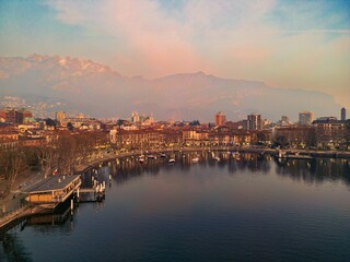 Drone shot of the city of Lecco, Italy. Mount Resegone in the background