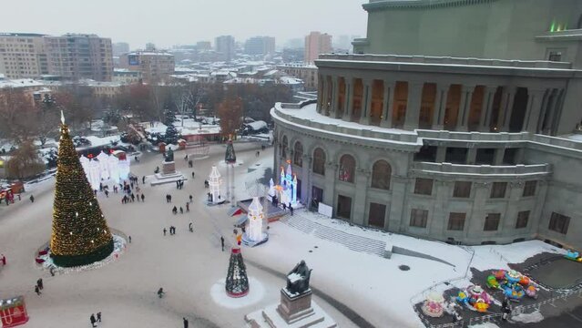 Freedom Square with Christmas tree and people near Opera and Ballet House