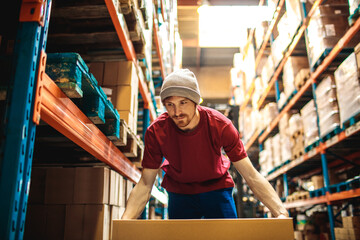 Young male warehouse worker working in a warehouse