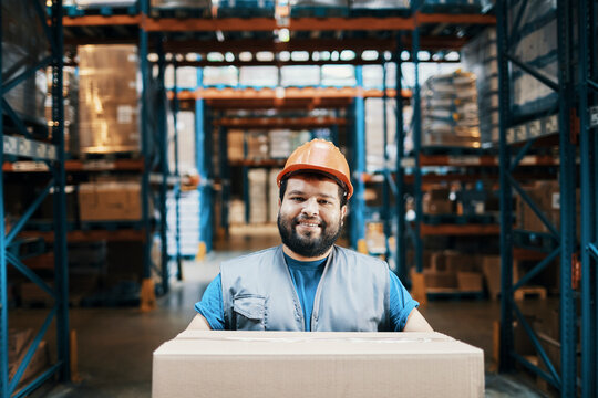 Smiling portrait of a male warehouse worker