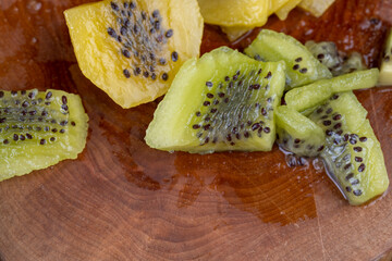 yellow green kiwi with dark seeds, delicious kiwi