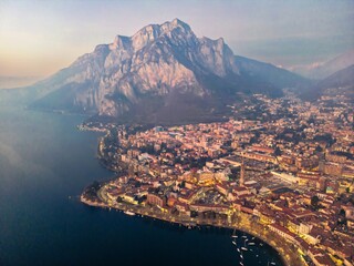 Drone shot of the city of Lecco and Lake Como at dusk, Italy. 