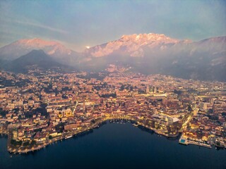 Drone shot of the city of Lecco and Lake Como, Italy. Mount Resegone in the background