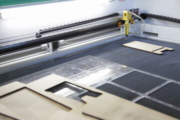 Laser cutter CNC machine for Plywood Laser cutting process - woodworking industry equipment - obrazy, fototapety, plakaty