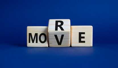 More Move symbol. Wooden cubes with words More Move. Beautiful deep blue background. Business concept and More Move. Copy space