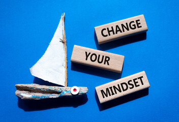 Change your mindset symbol. Concept words Change your mindset on wooden blocks. Beautiful blue...