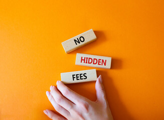 No hidden fees symbol. Concept word No hidden fees on wooden blocks. Businessman hand. Beautiful...