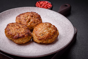 Delicious fresh fried minced fish cutlets with spices and herbs