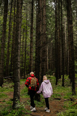 Fototapeta premium Couple walking in mountain forest