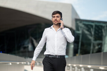 Dark-haired young man talking on the phone