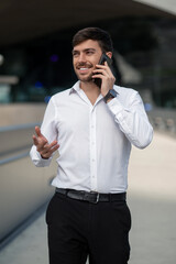 Dark-haired young man talking on the phone