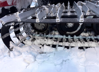 Snowcat machine for snow removal. Preparation ski trails. Snow groomer. Snowy tracks of snowcat in...