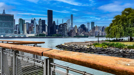 Strolling along the pier viewer and observer of Long Island is an island that extends from the east...
