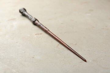 One magic wand on light textured background, closeup