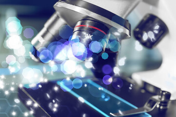 Microscope with glass slide, closeup. Laboratory equipment. Bokeh effect
