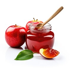 Apple jam in glass jar with apple and silver spoon isolated on white background