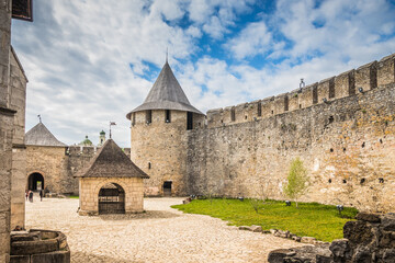 Courtyard and part of the wall of old castle Hotel near the river. Khotyn Fortress - medieval...