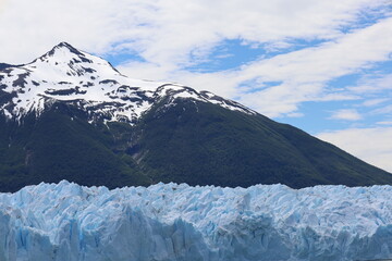 Perito Moreno glacier and mountain on cloudy sky