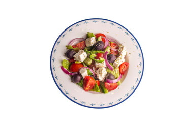 Greek salad with fresh vegetables, feta cheese and kalamata olives. Healthy food.