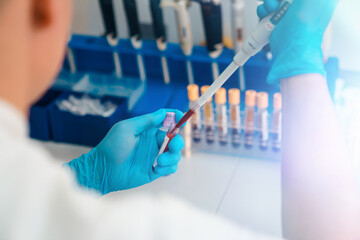 Healthcare, pharmaceutical scientist with test tube for DNA study, cure and RNA analysis.