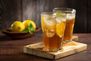 Glass of iced tea with lemon and mint.