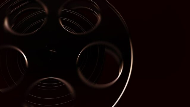 Movie tape, graphics composition detail element. Reel tape spool rolling in a dark classic cinema concept. CG close up horizontal wipe transition shot, ideal for movie show intros, logos or transition