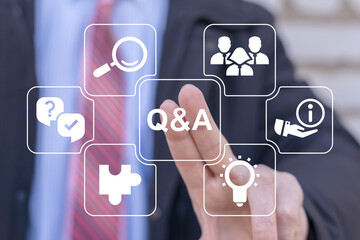 Businessman using virtual touch screen presses abbreviation: Q and A. Questions and Answers ( Q and...