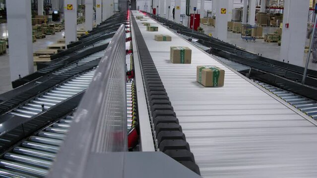 Orders boxes move by conveyer in Ozon company logistic center. Timelapse