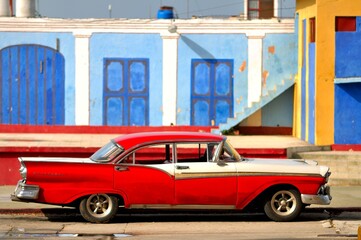 A cuban red old car parked in Trinidad town, Cuba.