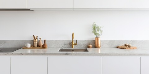 White cabinets with brass knobs and granite countertop in a modern minimalist Scandinavian kitchen.