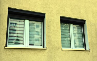 View of the windows of a block of flats made of prefabricated concrete slabs