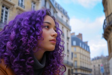 Girl with electric violet curly hair in a historical European city square