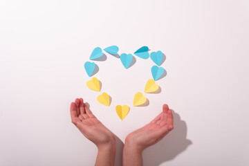 Ukraine heart flag yellow blue hands kid children little background white 