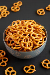 Mini Pretzels with Salt in a Bowl, side view.