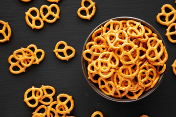 Mini Pretzels with Salt in a Bowl, top view. Flat lay.